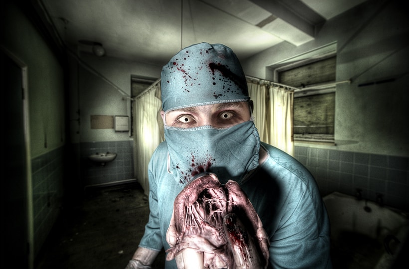 Insane doctor holding heart