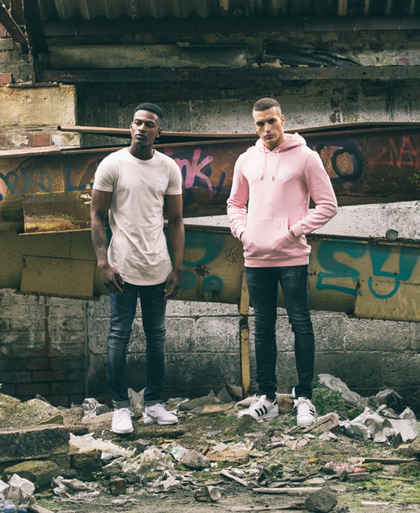 two guys in hood and tee wearing KWD