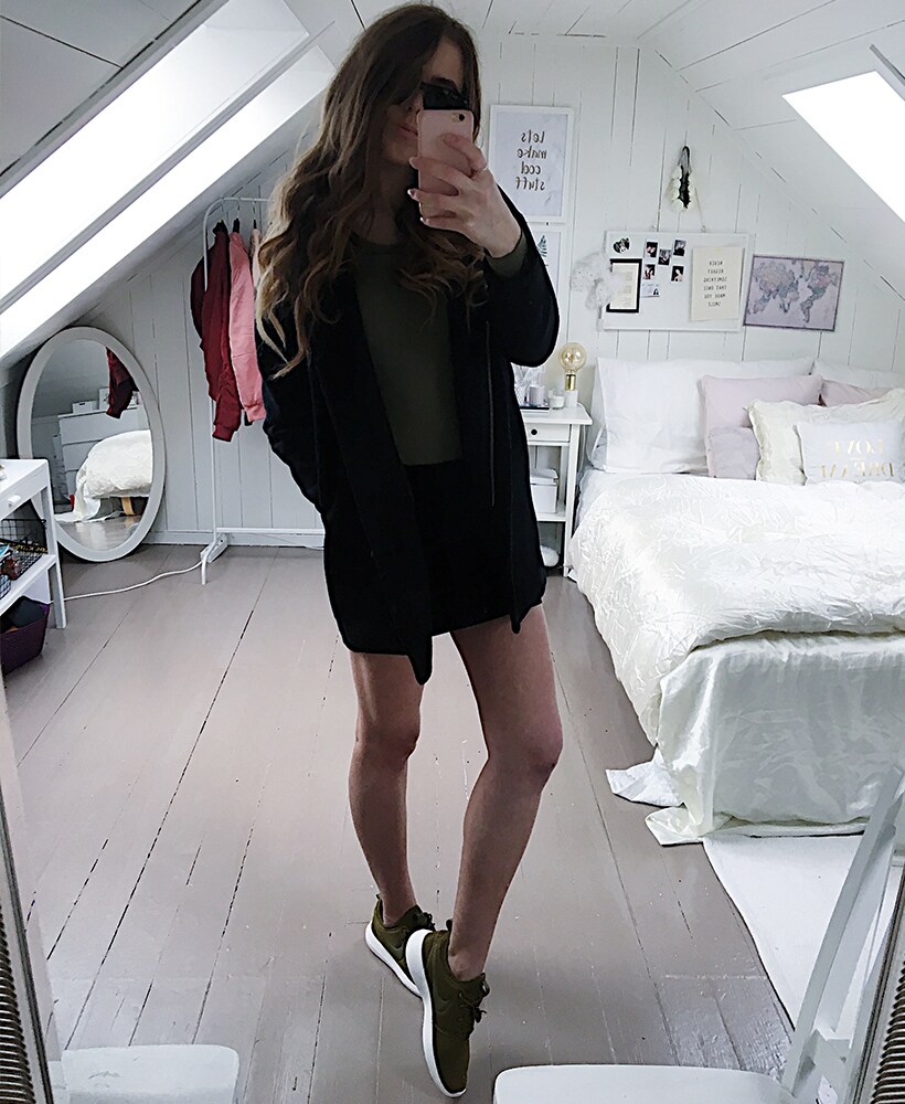 Malin Pettersen in black jacket, black skirt and Nike Roshe Two