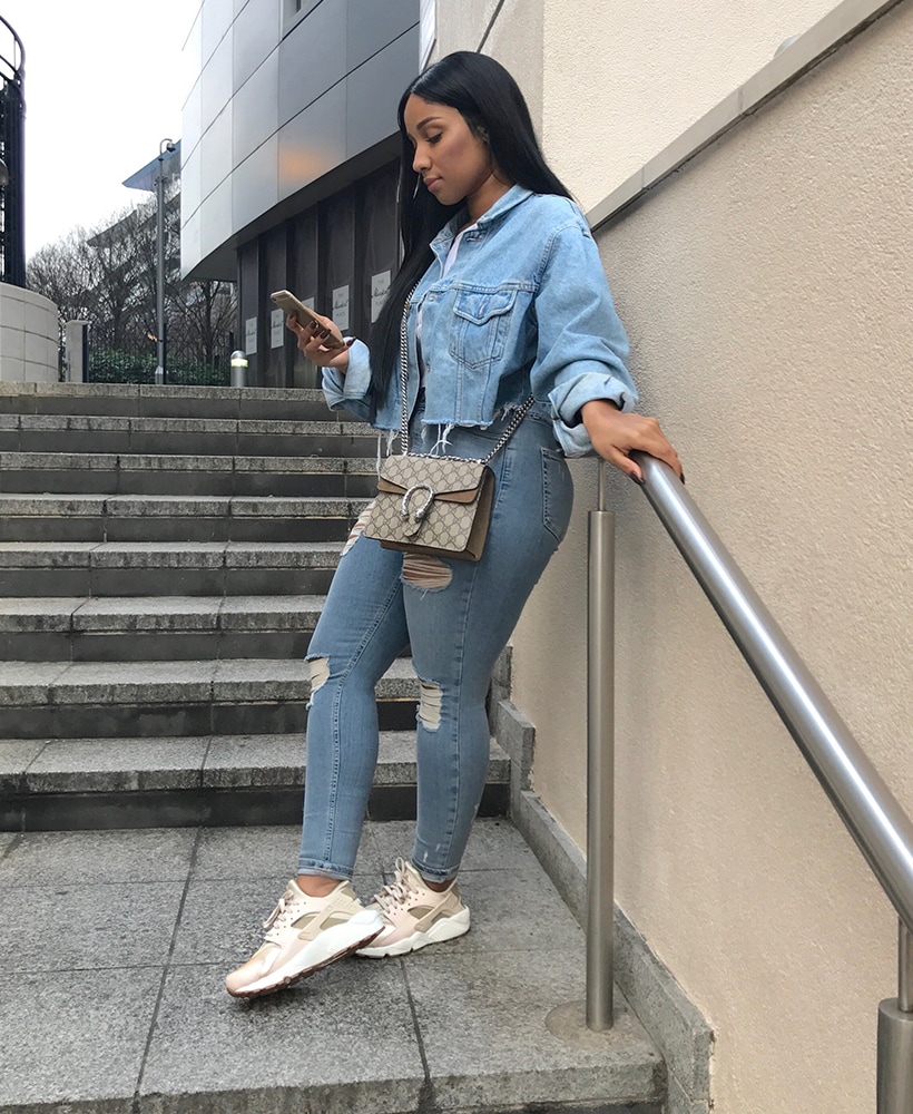 Shrlina Nym stood on stairs in Nike Air Huarache