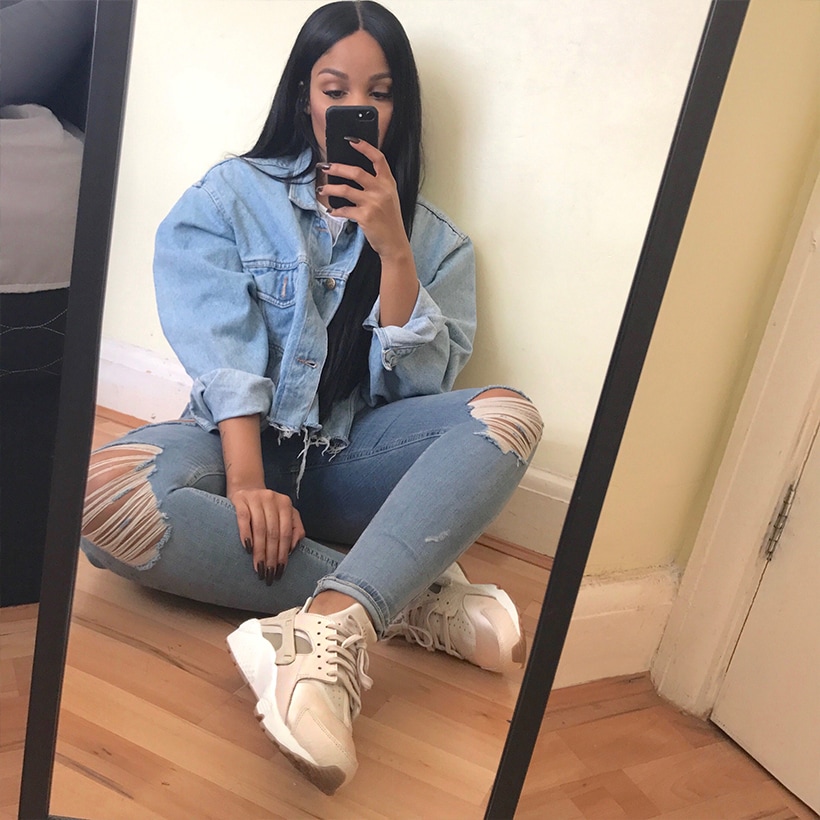 Sherlina Nym sat in front of mirror wearing Nike Air Huaraches