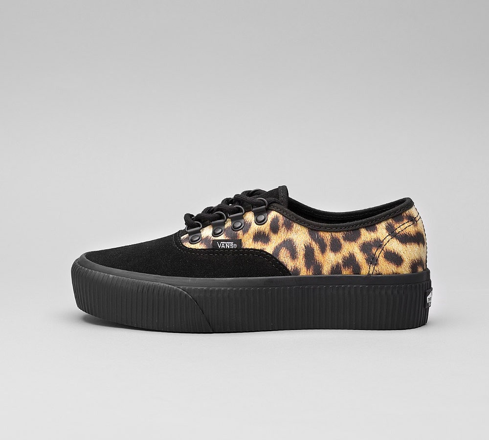 leopard and black trainers