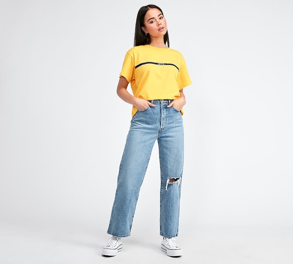 blue ripped knee jeans
