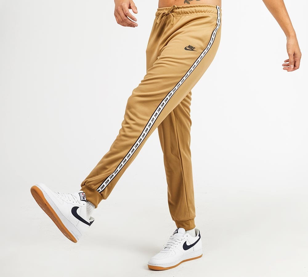 nike repeat tape track pants