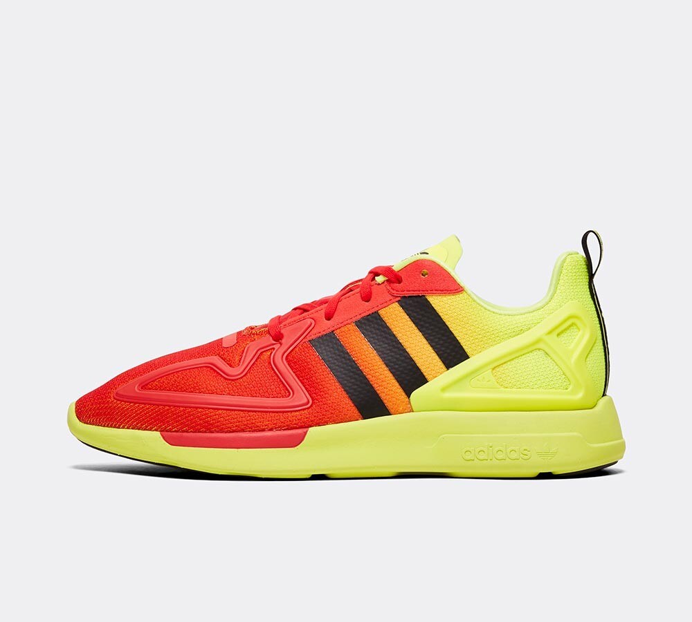 red and yellow adidas trainers