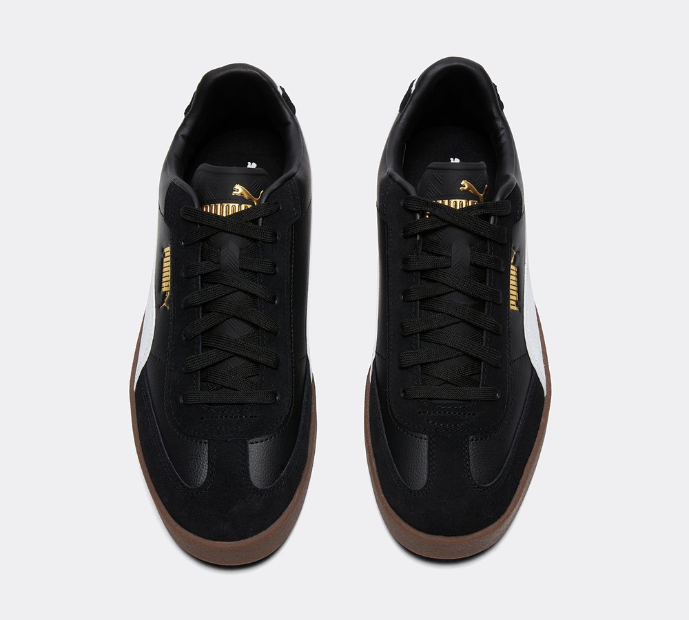 black white and gold pumas