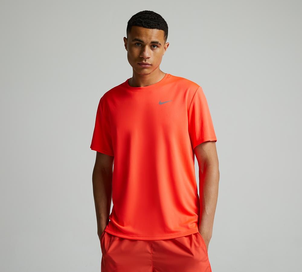 red yellow and orange nike shirt