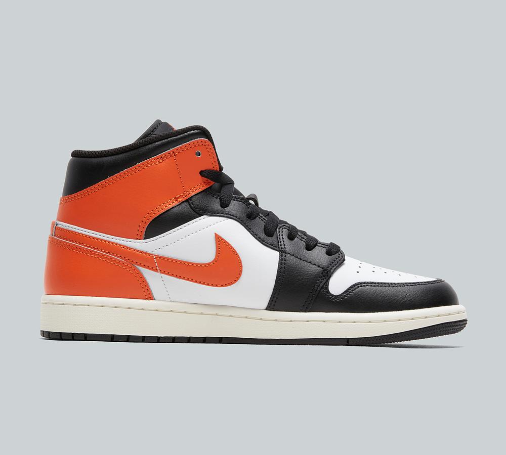 orange and white jordan shoes