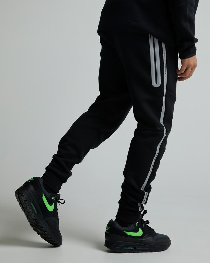 grey nike sweatpants black stripe