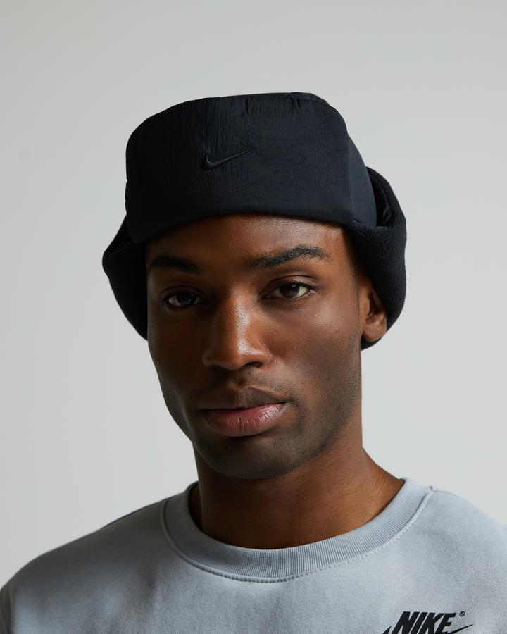 Nike Fly Puffer Trapper Cap | Black / Sandrift | Footasylum