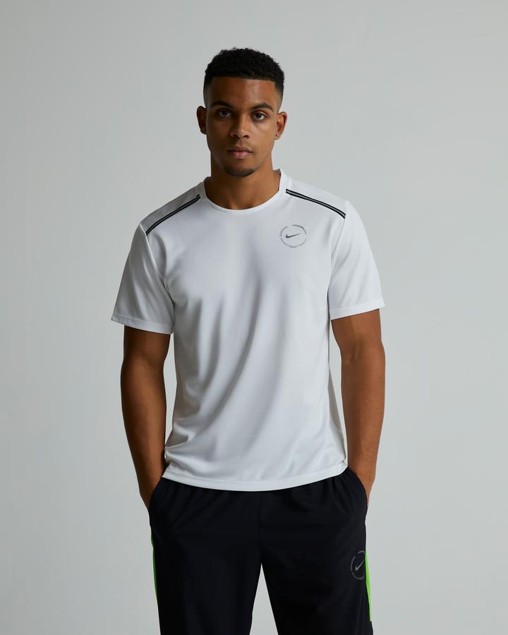 green strike nike shirt