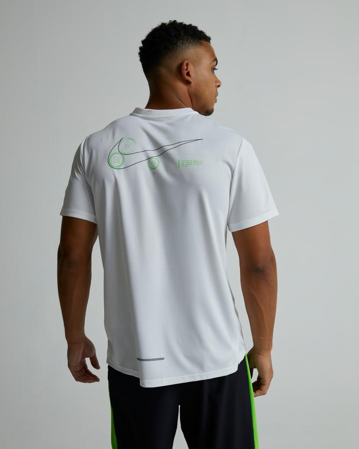 white nike shirt with green swoosh