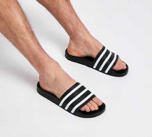 adidas adilette slides on feet