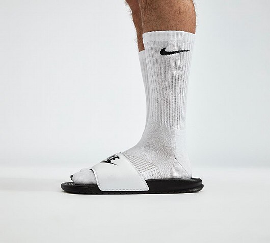 nike benassi slides on feet