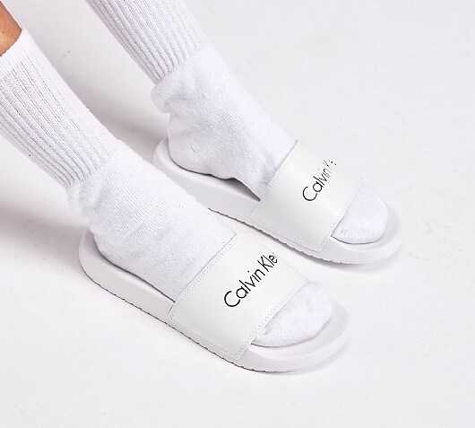 womens white calvin klein sliders