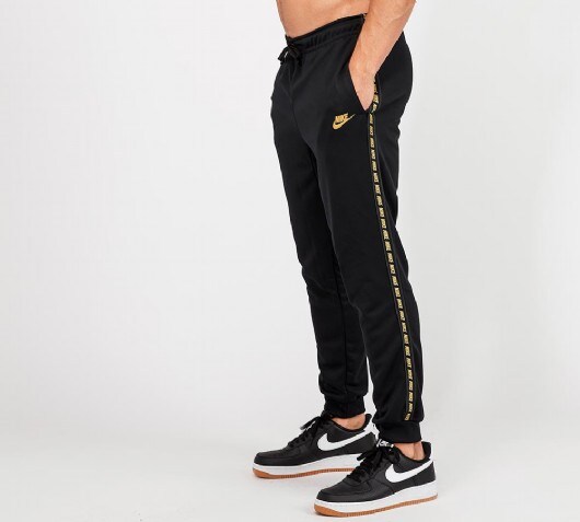 nike black and gold track pants