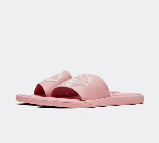 white and pink lacoste sliders