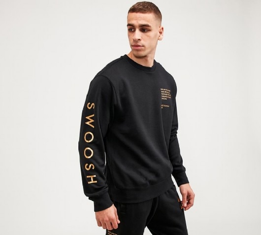 black nike sweatshirt with gold swoosh