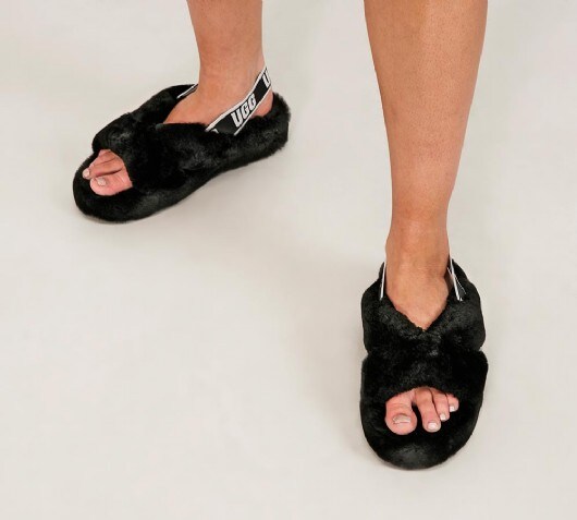 black white ugg slides