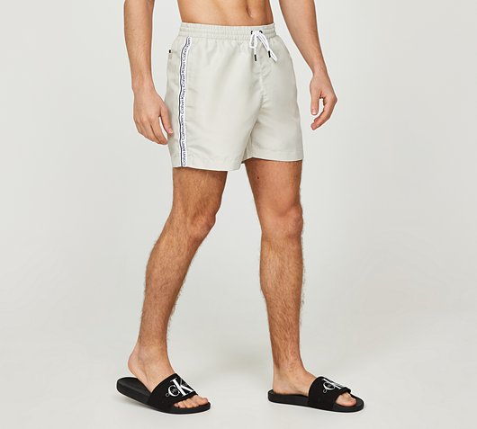 Calvin Klein Swim Core Logo Taped Swim Short | Stony Beige | Footasylum