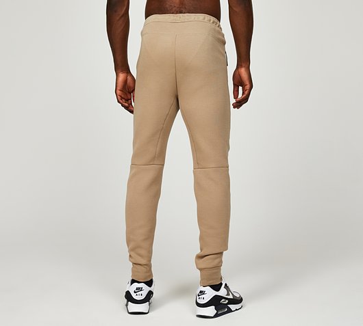 nike tech beige pants
