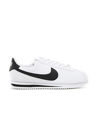 nike cortez leather trainers in white with black swoosh