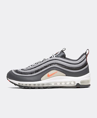 white nike trainers with orange tick